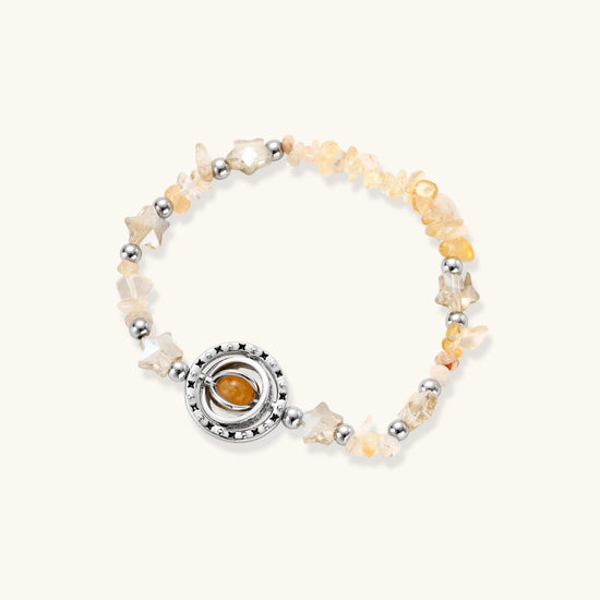 Complete jewelry set featuring citrine stone chips, silver beads, and cosmic circle pendants on cream background.