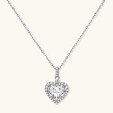 Complete jewelry set with heart-shaped sterling silver pieces featuring brilliant moissanite stones on white background.