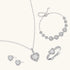 Complete jewelry set with heart-shaped sterling silver pieces featuring brilliant moissanite stones on white background.
