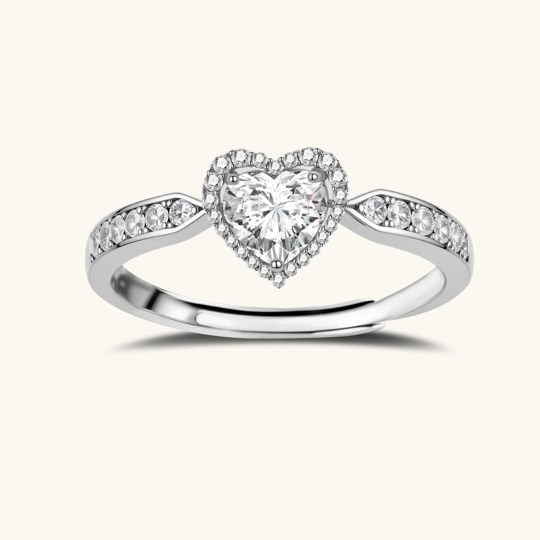 Complete jewelry set with heart-shaped sterling silver pieces featuring brilliant moissanite stones on white background.