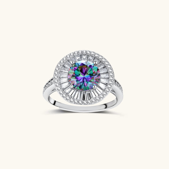 Close-up of sterling silver halo ring with round rainbow moissanite center stone surrounded by baguette-cut stones