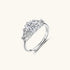 Sterling silver ring with oval moissanite center stone surrounded by smaller accent stones in ornate setting