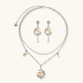 Delicate eco-brass jewelry set featuring gold star and silver moon crescents with clear zirconia crystal drops on cream background