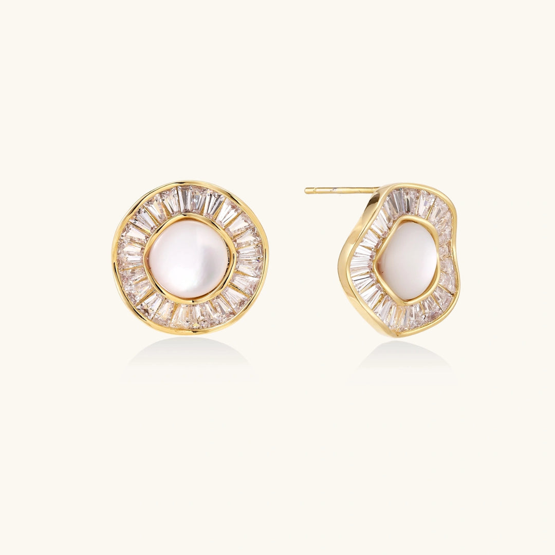 Round 14K gold-plated stud earrings with a mother of pearl center surrounded by baguette-cut crystals, 16mm.