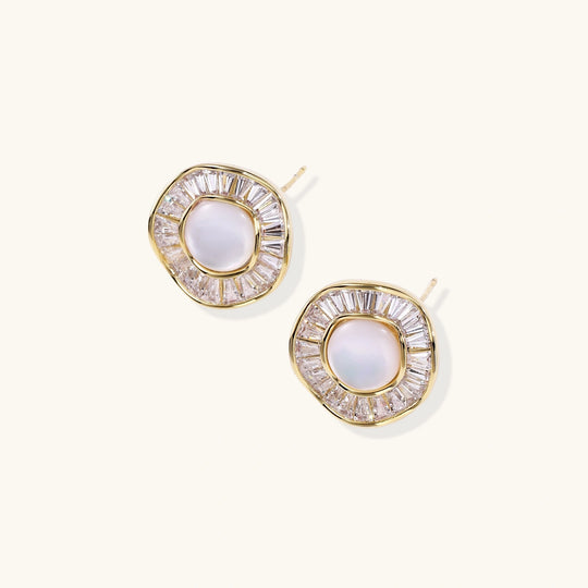 Round 14K gold-plated stud earrings with a mother of pearl center surrounded by baguette-cut crystals, 16mm.
