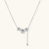 White gold plated Y-shaped necklace with three dimensional flower charms and adjustable drop pendant