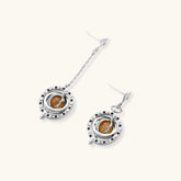 Complete jewelry set featuring citrine stone chips, silver beads, and cosmic circle pendants on cream background.