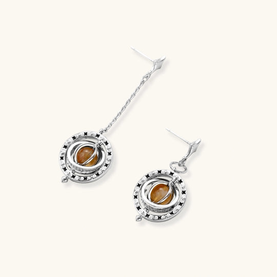 Complete jewelry set featuring citrine stone chips, silver beads, and cosmic circle pendants on cream background.