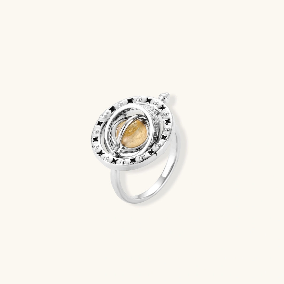 Complete jewelry set featuring citrine stone chips, silver beads, and cosmic circle pendants on cream background.