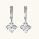 Sterling silver huggie hoops with geometric diamond-shaped moissanite dangles featuring pavé crystal details