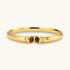Polished gold bangle with two oval tiger&